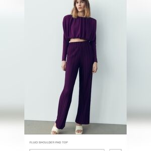 Fluid shoulder pad top